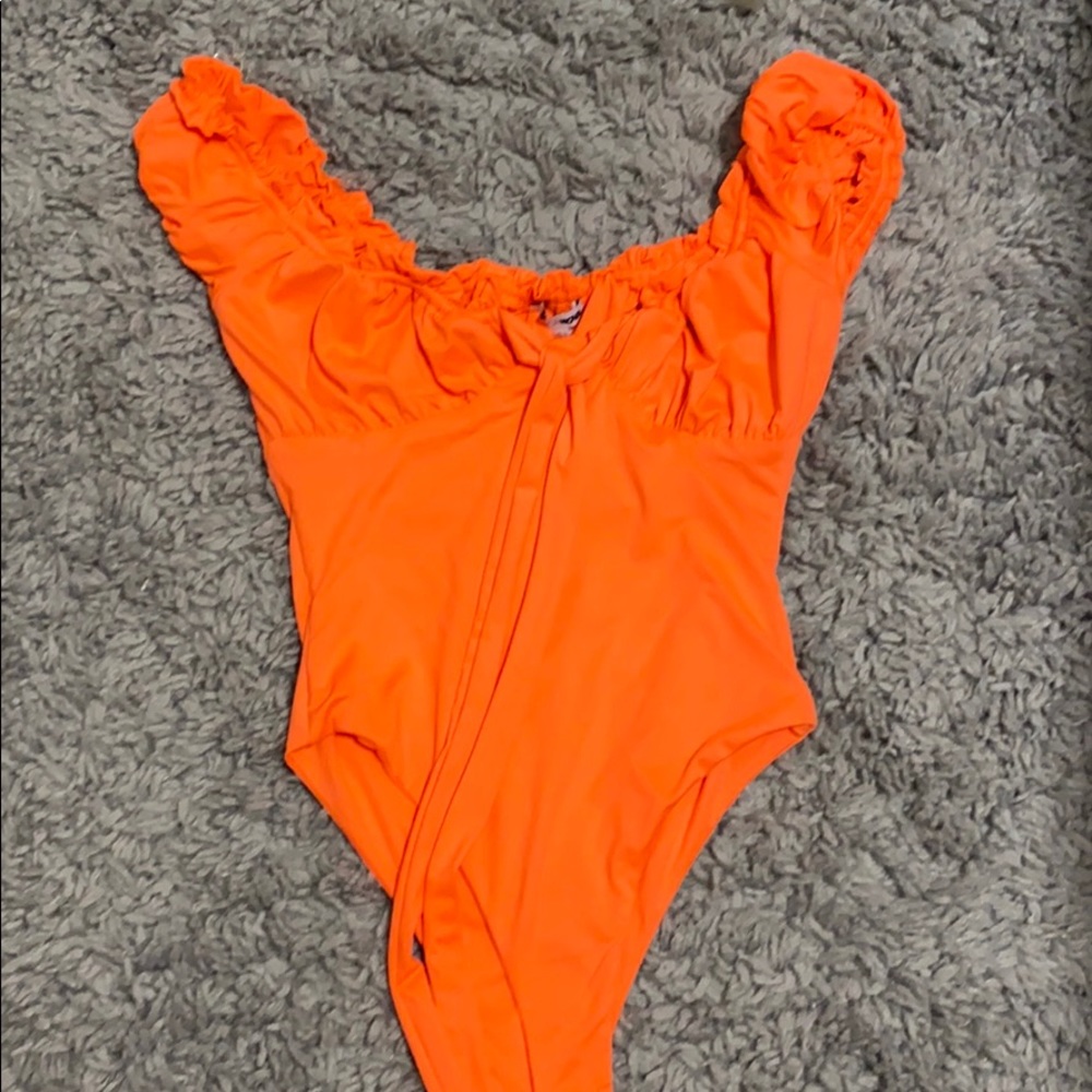 Orange body suit